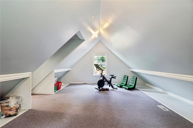 workout room with lofted ceiling and carpet floors