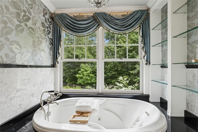 full bathroom with healthy amount of natural light, a tub with jets, and crown molding