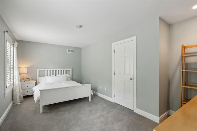bedroom featuring carpet floors and baseboards