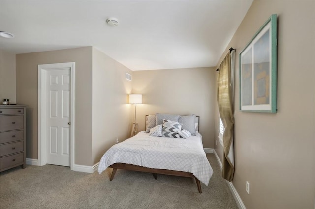 carpeted bedroom with baseboards