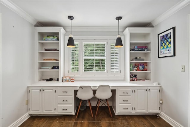 office space with built in desk, crown molding, dark wood-style flooring, and baseboards