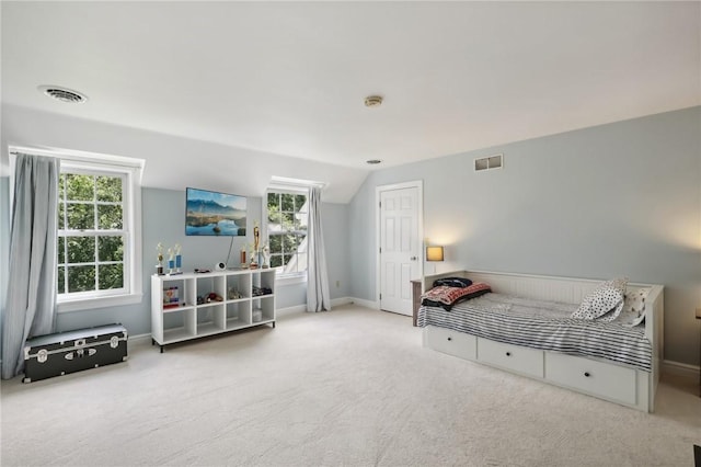 bedroom with carpet flooring, multiple windows, lofted ceiling, and baseboards