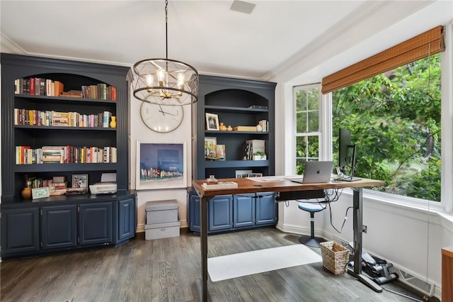 office space with dark wood-type flooring, a chandelier, and ornamental molding