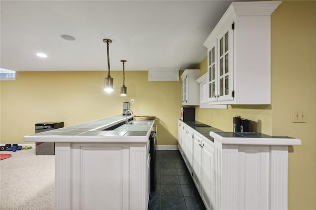 kitchen with white cabinets, glass insert cabinets, decorative light fixtures, baseboards, and recessed lighting
