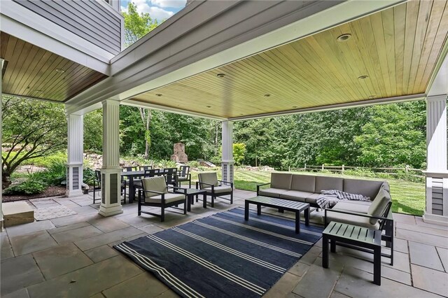 view of patio / terrace featuring an outdoor living space and outdoor dining area