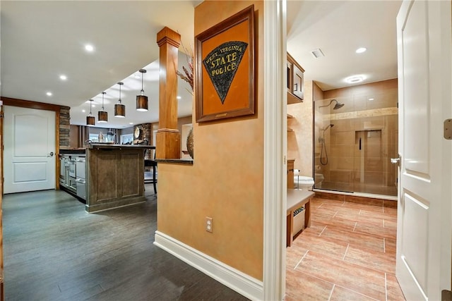hall with recessed lighting, wood finished floors, and baseboards
