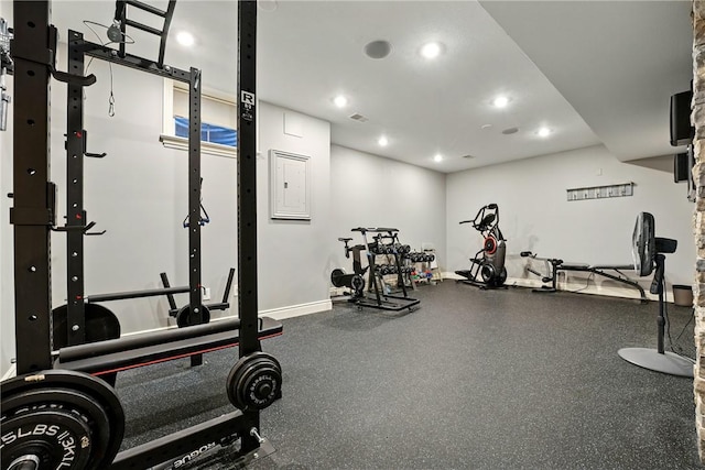 exercise room featuring recessed lighting and baseboards