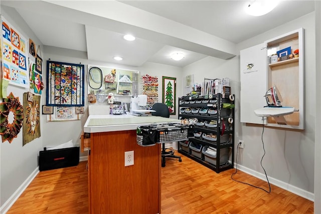 office featuring light wood-style flooring, baseboards, and recessed lighting