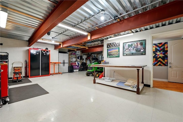 garage featuring baseboards