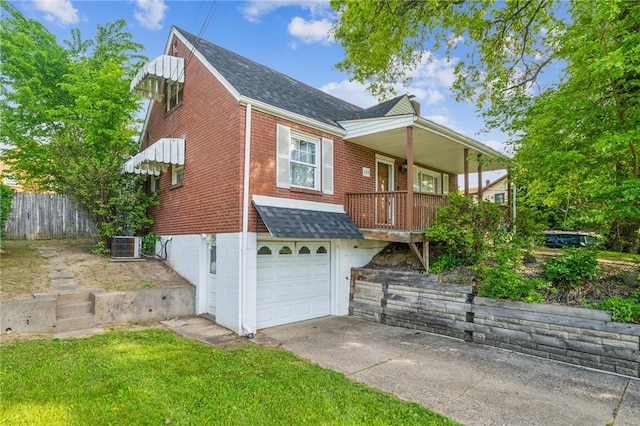 339 Hamil Rd, Penn Hills, PA 15147 - view of front of home with driveway, a garage, roof with shingles, and central AC
