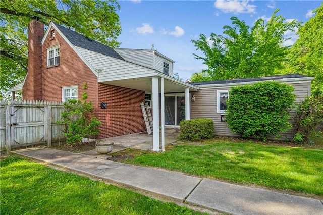 339 Hamil Rd, Penn Hills, PA 15147 - view of front of home featuring a chimney, a patio, and brick siding