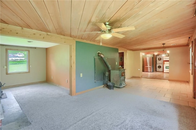 138 Bovard Ln, Cherry Twp, PA 16020 - unfurnished living room featuring wood ceiling, a wood stove, ceiling fan, and carpet flooring