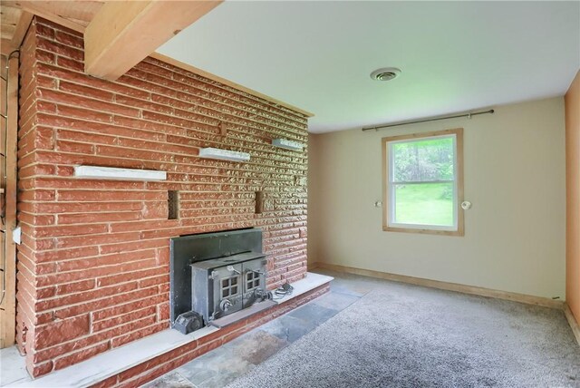 138 Bovard Ln, Cherry Twp, PA 16020 - unfurnished living room featuring a wood stove and baseboards