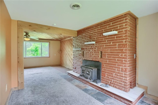 138 Bovard Ln, Cherry Twp, PA 16020 - unfurnished living room featuring a wood stove, a ceiling fan, carpet flooring, baseboards, and wooden ceiling