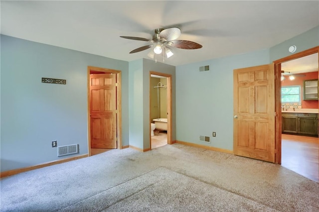 138 Bovard Ln, Cherry Twp, PA 16020 - unfurnished bedroom with ensuite bath, baseboards, light colored carpet, and a ceiling fan