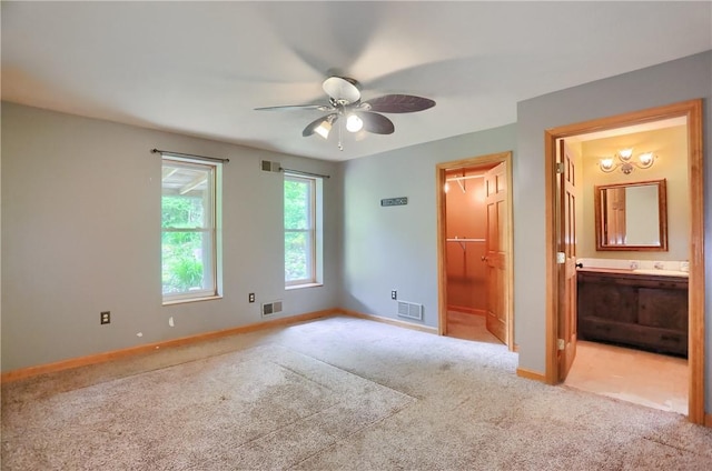 138 Bovard Ln, Cherry Twp, PA 16020 - unfurnished bedroom with carpet floors, baseboards, connected bathroom, and a ceiling fan