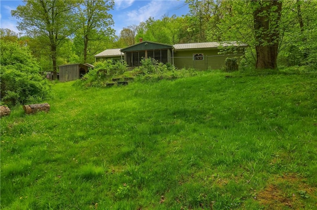 138 Bovard Ln, Cherry Twp, PA 16020 - view of yard with a sunroom, an outbuilding, and a storage unit