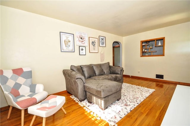 525 Joffre Bulger Rd, Smith, PA 15021 - living area with wood finished floors, arched walkways, and baseboards