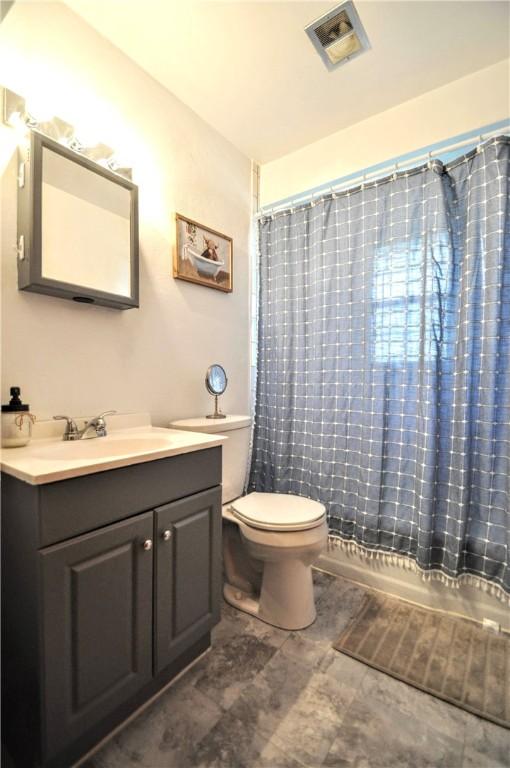 525 Joffre Bulger Rd, Smith, PA 15021 - full bathroom featuring toilet, vanity, and a shower with shower curtain