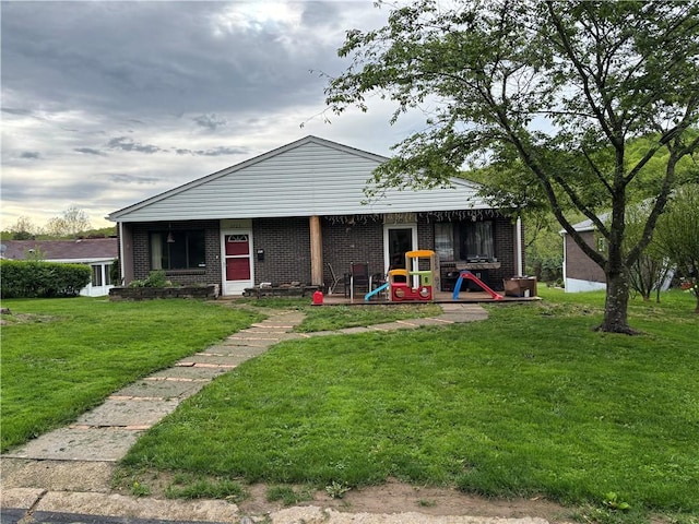 2723 Kingston Dr, Natrona Hts/Harrison Twp, PA 15065 - back of house with a yard and brick siding