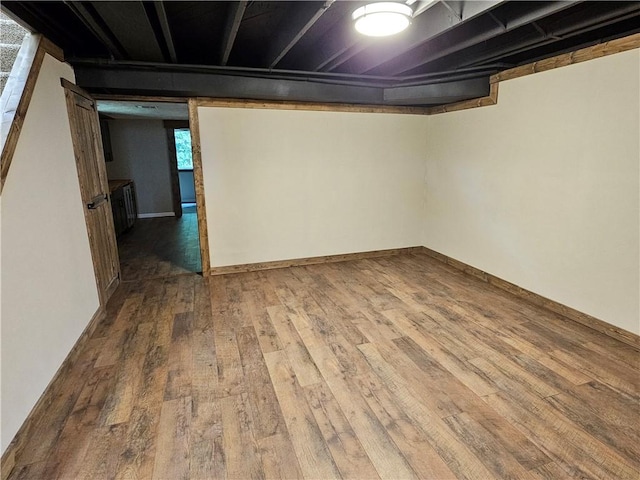 basement featuring wood-type flooring
