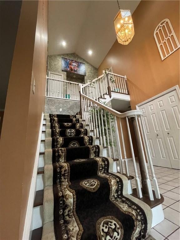 228 Meadowfield Ln, Jefferson Hills, PA 15025 - staircase with high vaulted ceiling and tile patterned floors