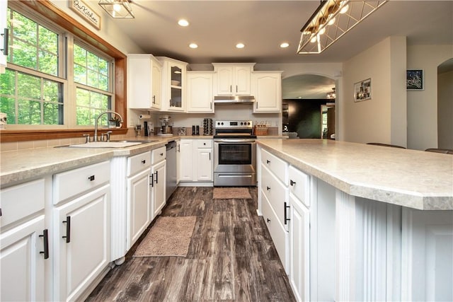 529 Mill Creek Rd, Mill Creek, PA 16362 - kitchen with stainless steel appliances, arched walkways, a sink, under cabinet range hood, and recessed lighting