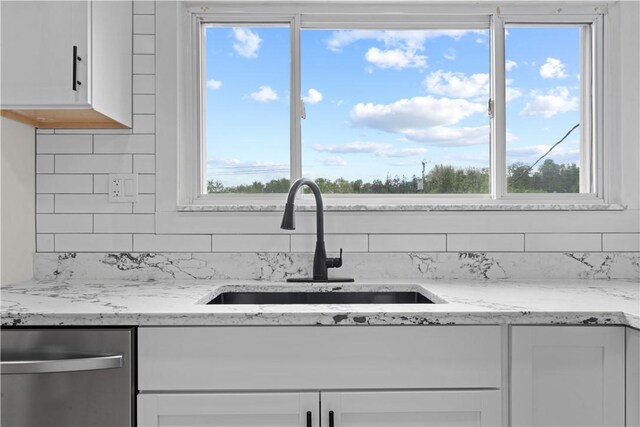 5056 Don St, Finleyville, PA 15332 - kitchen featuring stainless steel dishwasher, a sink, white cabinets, and healthy amount of natural light