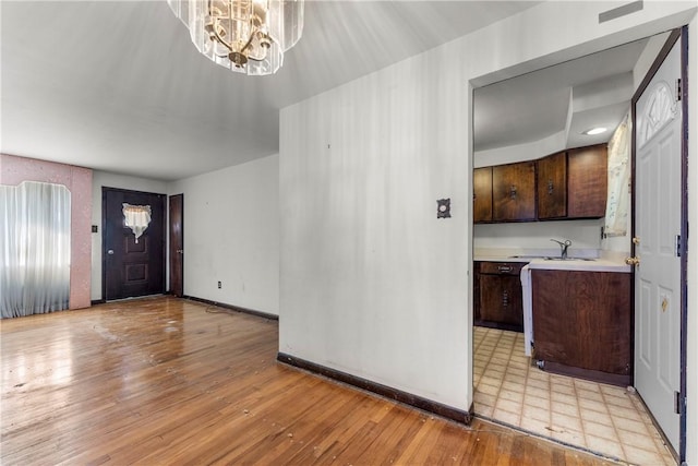 3735 Lyndell St, Castle Shannon, PA 15234 - entrance foyer with a chandelier, light wood-style floors, and baseboards