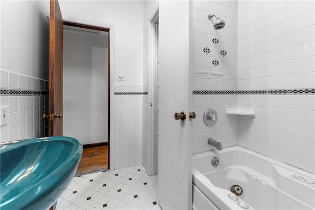 3735 Lyndell St, Castle Shannon, PA 15234 - bathroom featuring tile walls, tile patterned flooring, shower / tub combination, and a wainscoted wall