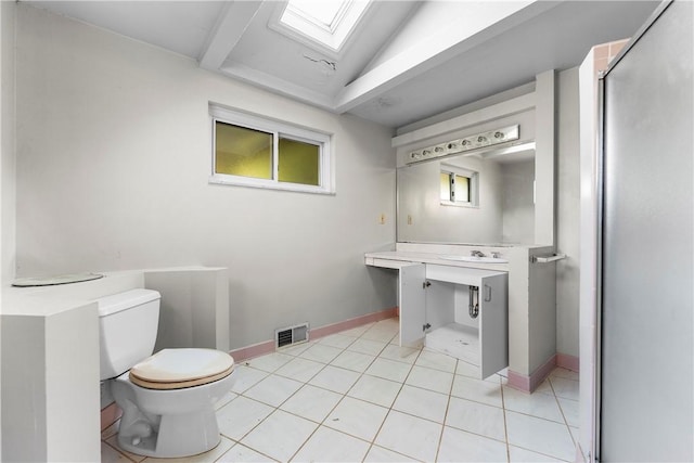 3735 Lyndell St, Castle Shannon, PA 15234 - bathroom with toilet, a skylight, vanity, a shower stall, and baseboards