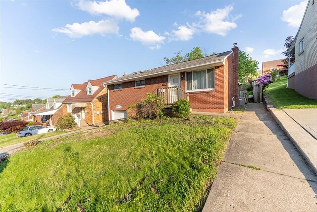3735 Lyndell St, Castle Shannon, PA 15234 - view of front of home featuring brick siding and a chimney