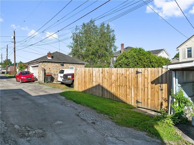 view of home's exterior with fence