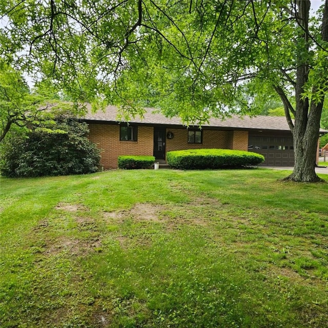 148 James St, Chippewa Twp, PA 15010 - ranch-style house featuring a garage, a front yard, and brick siding
