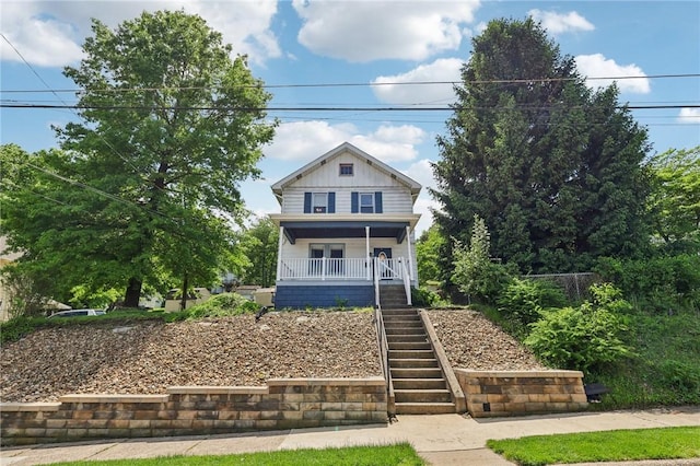506 7th Ave, Coraopolis, PA 15108 - view of front of property with stairs, a porch, and board and batten siding