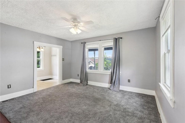 506 7th Ave, Coraopolis, PA 15108 - empty room with a textured ceiling, carpet floors, ceiling fan, and baseboards