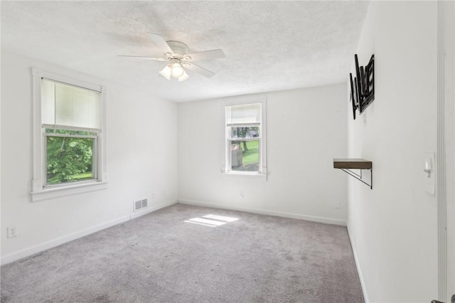 506 7th Ave, Coraopolis, PA 15108 - spare room with carpet floors, a ceiling fan, a textured ceiling, and baseboards