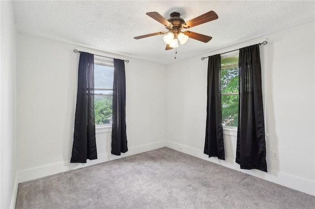 506 7th Ave, Coraopolis, PA 15108 - carpeted empty room with healthy amount of natural light, a ceiling fan, a textured ceiling, and baseboards