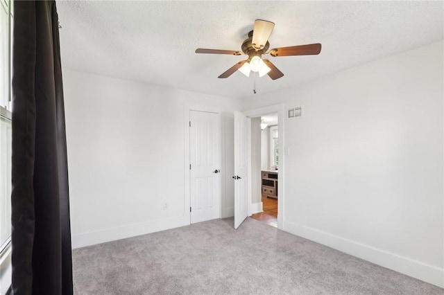 506 7th Ave, Coraopolis, PA 15108 - carpeted empty room with ceiling fan, baseboards, and a textured ceiling