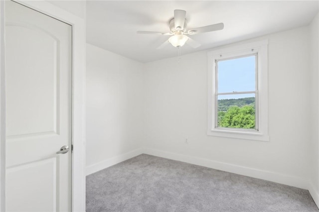 506 7th Ave, Coraopolis, PA 15108 - spare room featuring carpet, baseboards, and ceiling fan