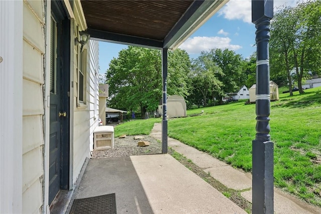 506 7th Ave, Coraopolis, PA 15108 - view of patio featuring a shed and an outbuilding