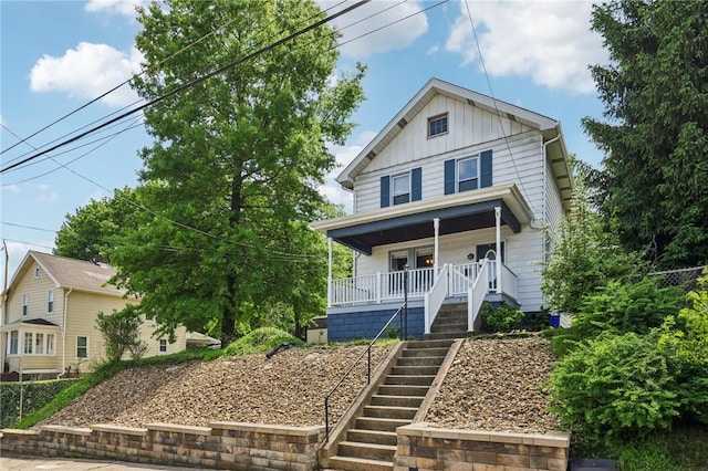 506 7th Ave, Coraopolis, PA 15108 - view of front of home featuring board and batten siding, covered porch, and stairway