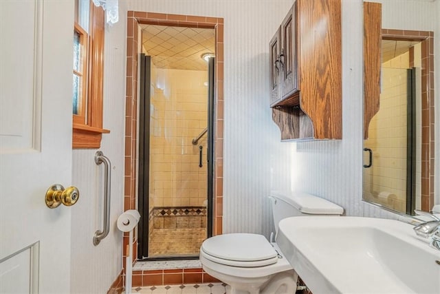 2652 Thorntree Dr, Upper St Clair, PA 15241 - bathroom with a sink, a shower stall, wallpapered walls, toilet, and tile patterned flooring