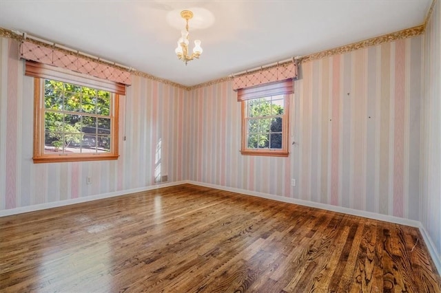 2652 Thorntree Dr, Upper St Clair, PA 15241 - empty room featuring wood finished floors, a chandelier, and baseboards