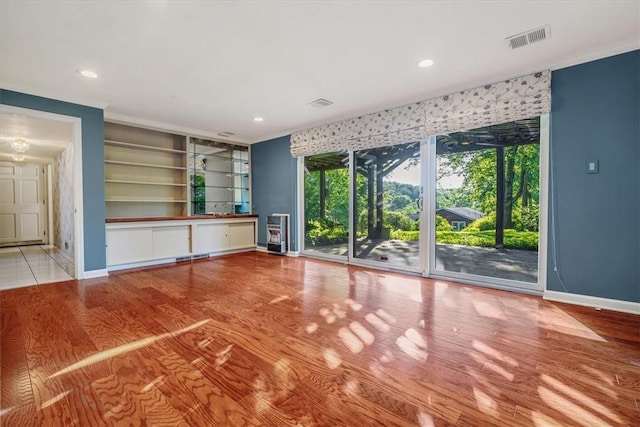2652 Thorntree Dr, Upper St Clair, PA 15241 - unfurnished living room with baseboards, wood finished floors, recessed lighting, and heating unit