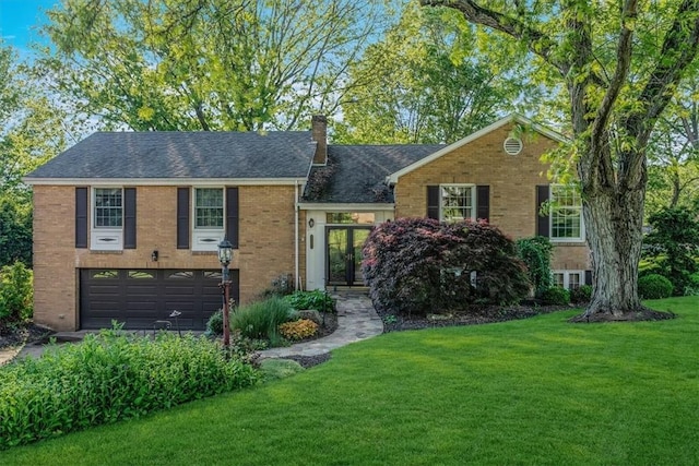 2652 Thorntree Dr, Upper St Clair, PA 15241 - view of front of property with a front lawn, an attached garage, brick siding, a chimney, and driveway
