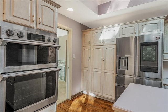 2652 Thorntree Dr, Upper St Clair, PA 15241 - kitchen with stainless steel appliances, wood finished floors, light countertops, light brown cabinetry, and recessed lighting