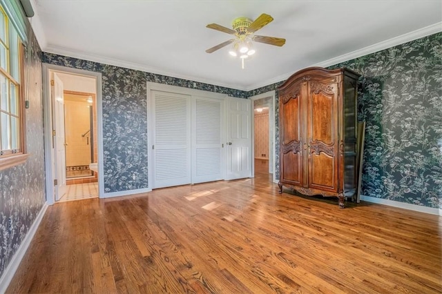 2652 Thorntree Dr, Upper St Clair, PA 15241 - unfurnished bedroom featuring wallpapered walls, wood finished floors, baseboards, crown molding, and a ceiling fan