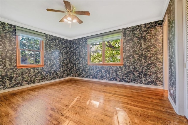 2652 Thorntree Dr, Upper St Clair, PA 15241 - unfurnished room featuring wood finished floors, a ceiling fan, baseboards, wallpapered walls, and ornamental molding