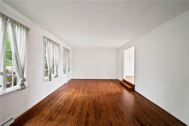 677 Harrogate Rd, Upper St Clair, PA 15241 - empty room with a baseboard heating unit, wood-type flooring, plenty of natural light, and crown molding